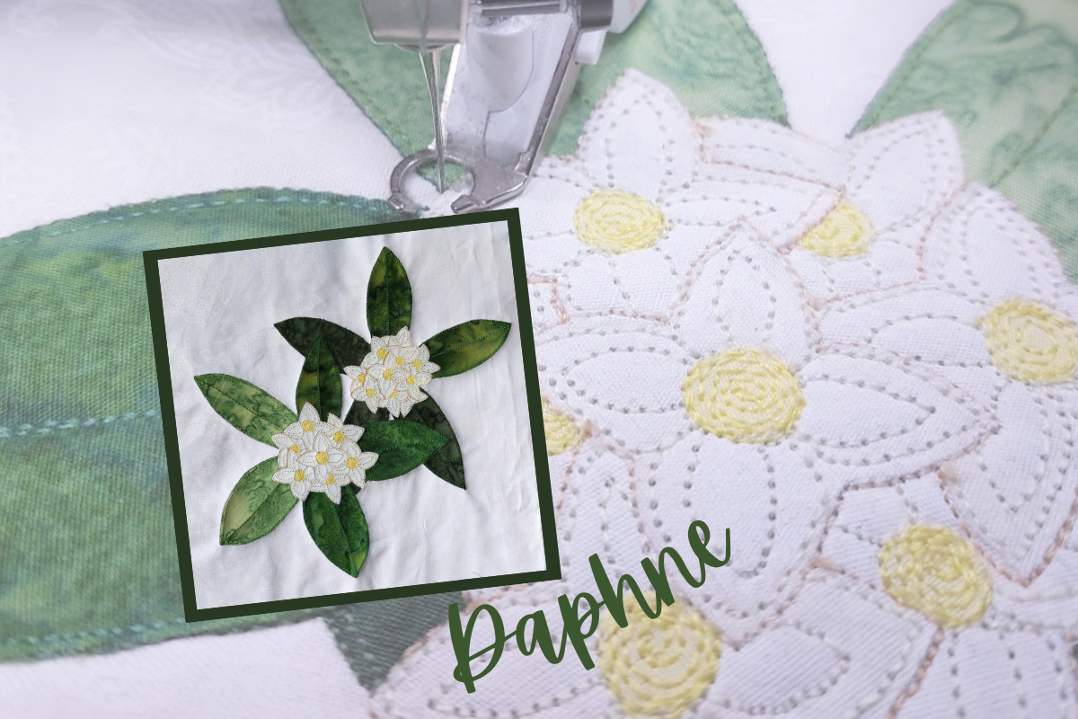 Quilt block with floral design and 'Daphne' text on a closeup background